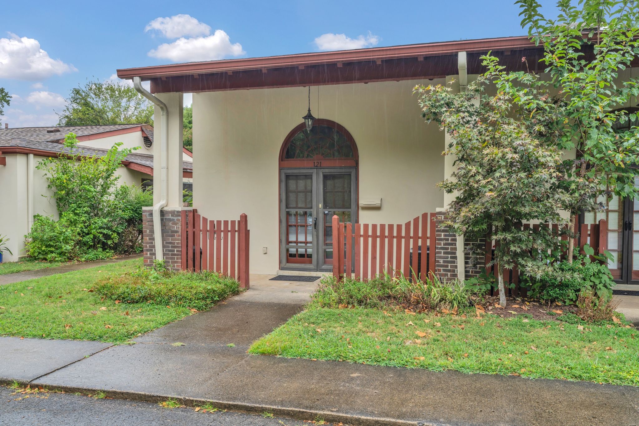 a front view of a house with garden