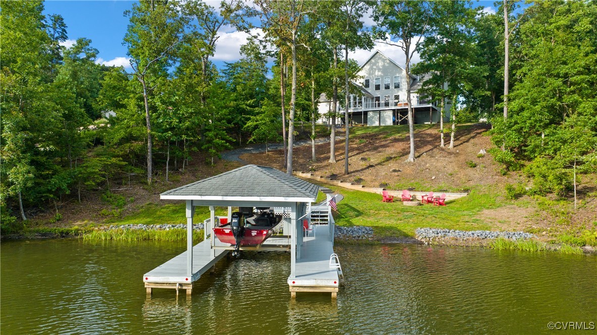 swimming pool view with a lake view