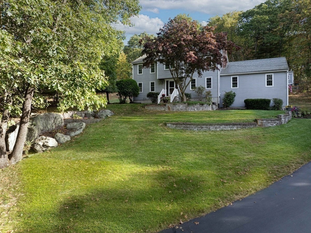 a front view of a house with a yard