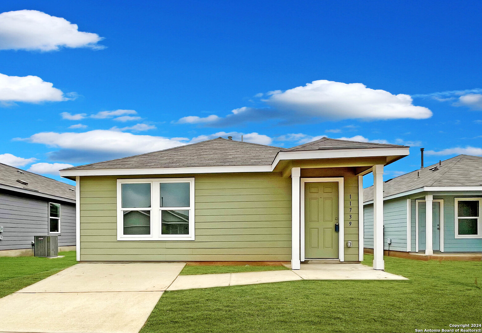 a view of a house with a backyard