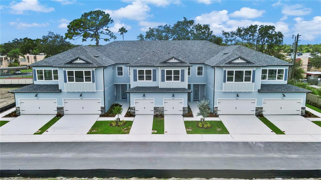 a view of house with yard in front of it