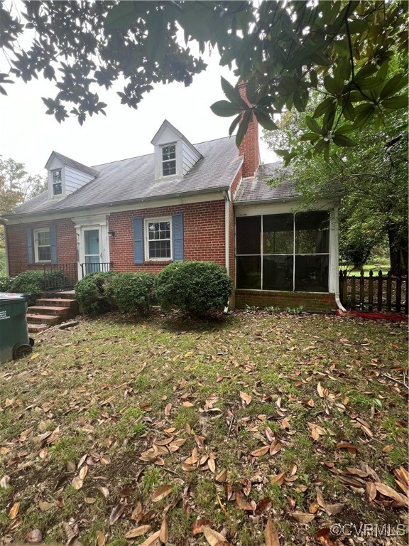 View of front facade featuring a sunroom