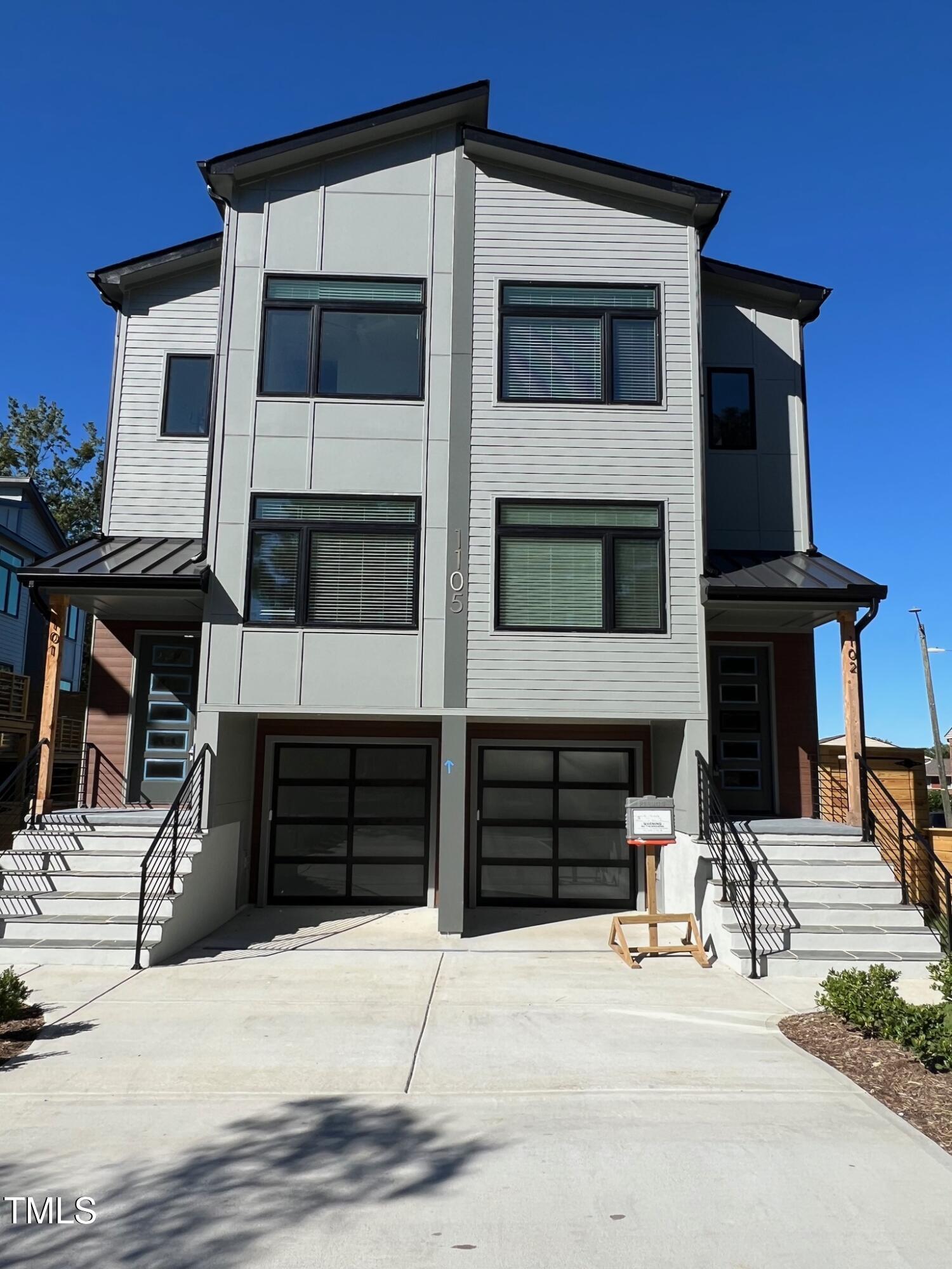 a front view of a house with parking