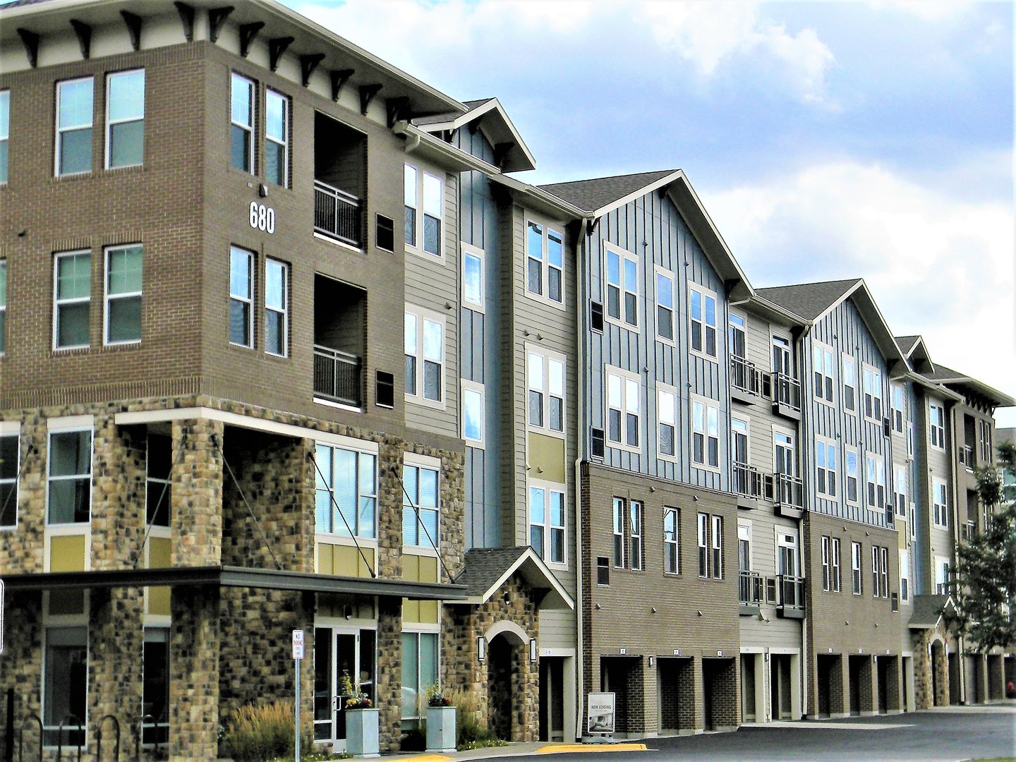 a front view of a building with a lot of windows