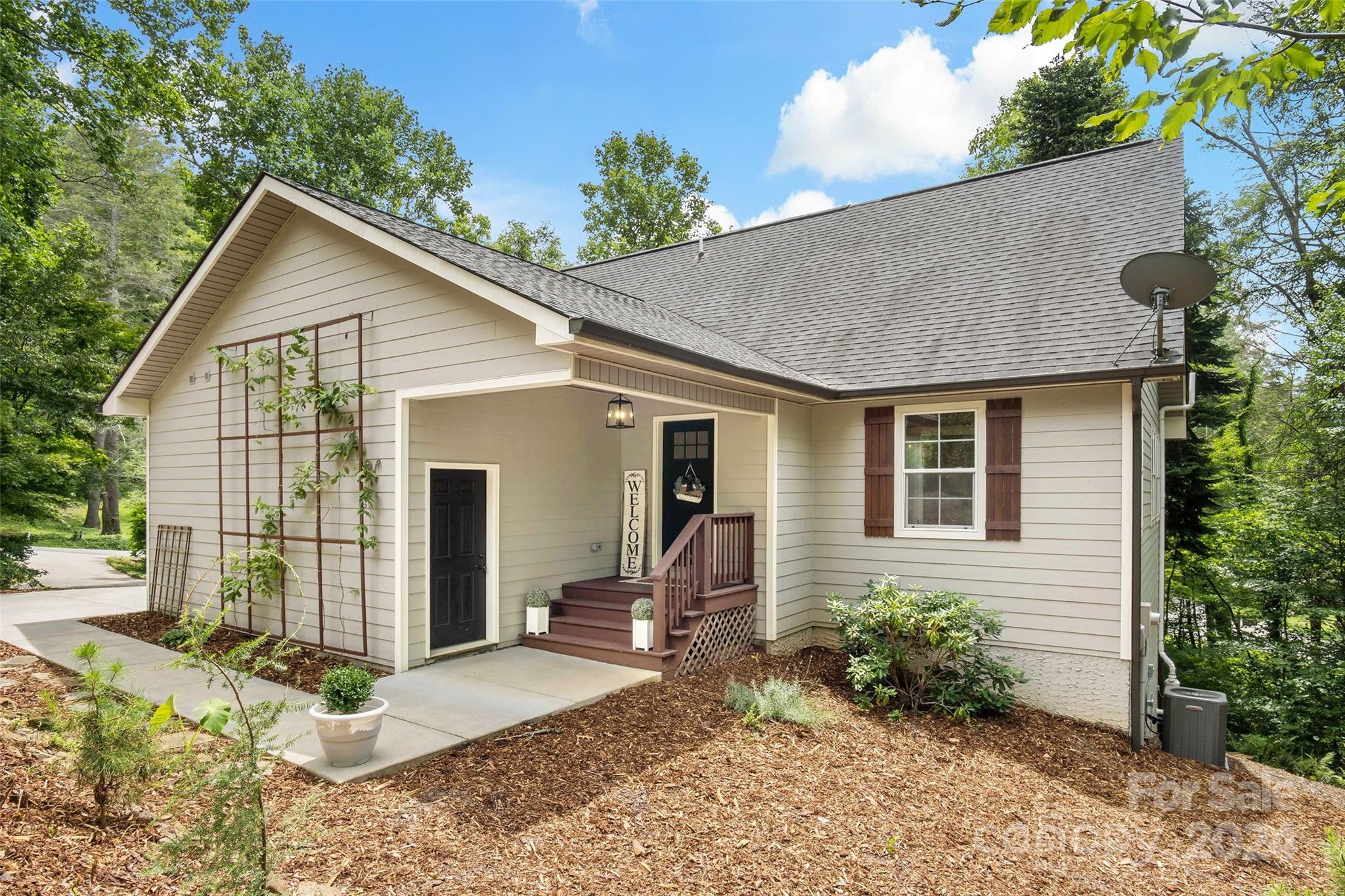 a front view of house with yard outdoor seating and barbeque oven