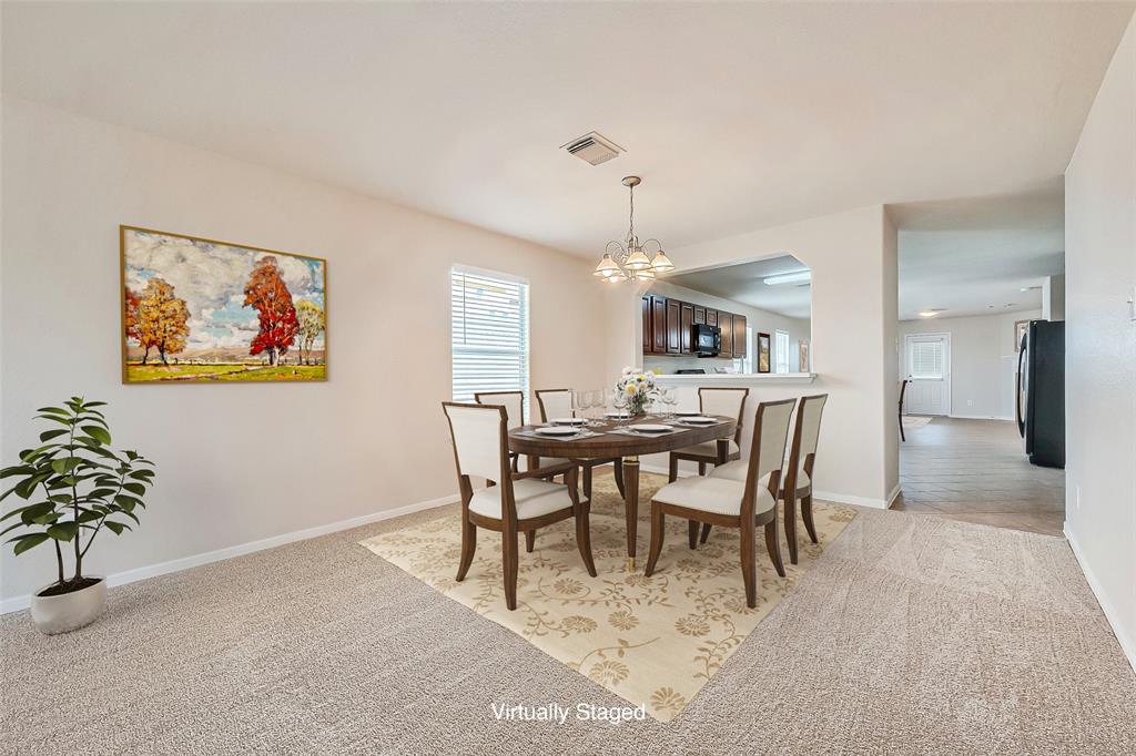 a view of a dining room with furniture