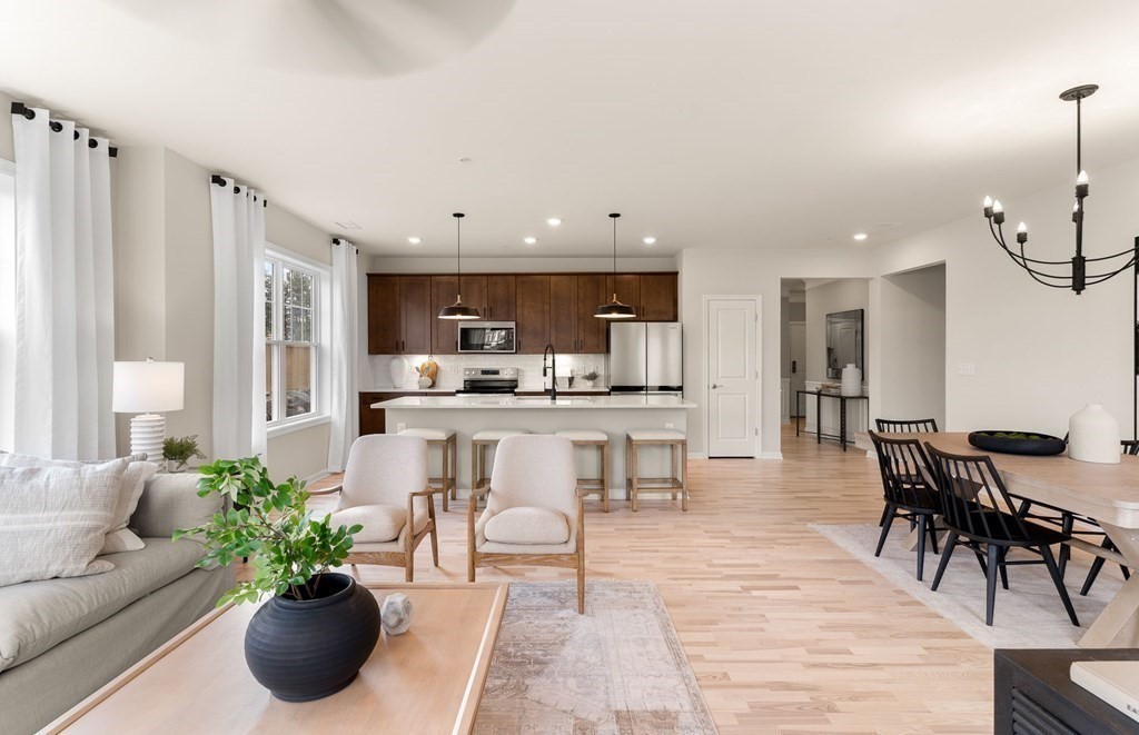 a view of kitchen with dining table and chairs