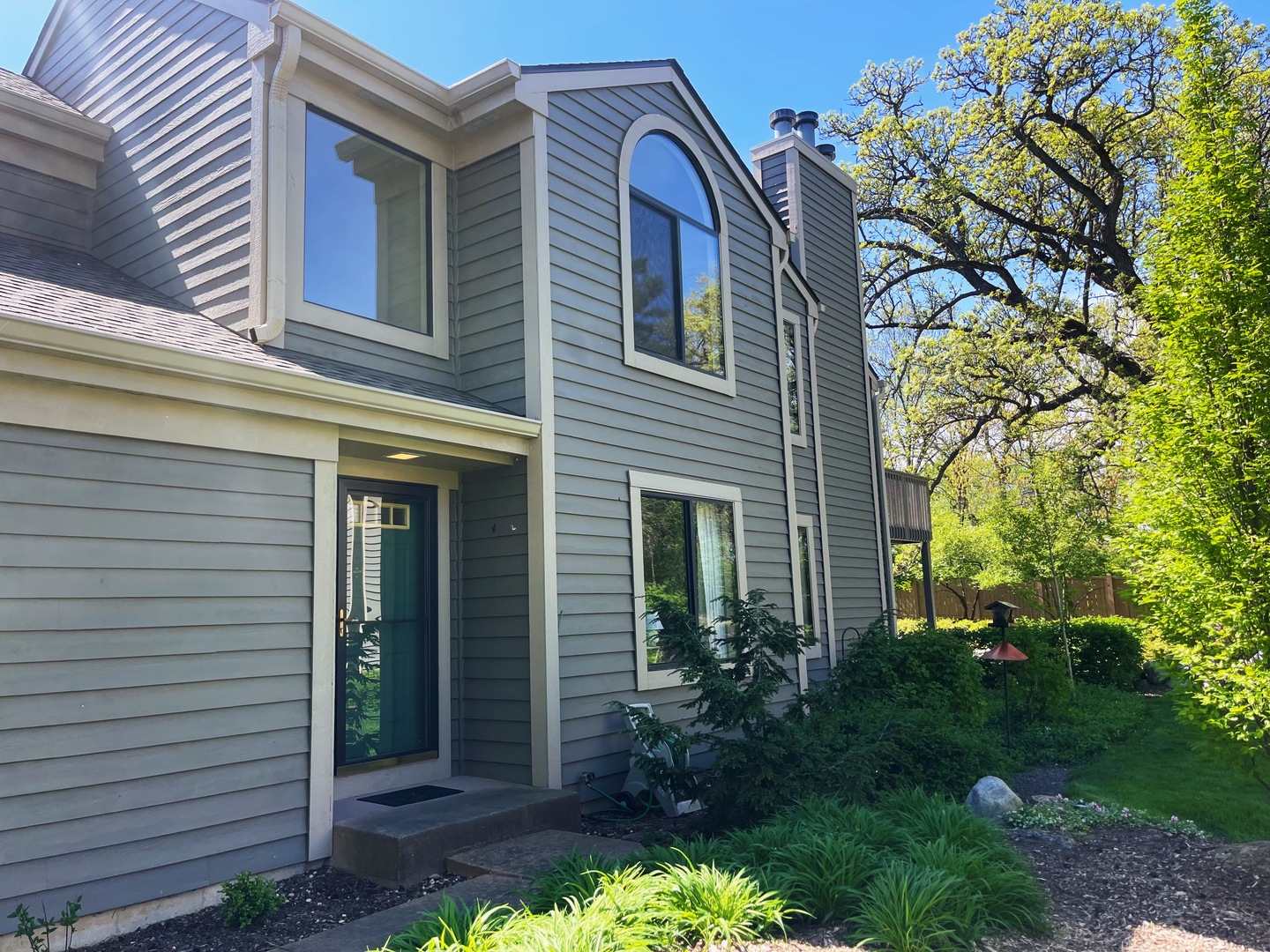 a front view of a house with garden