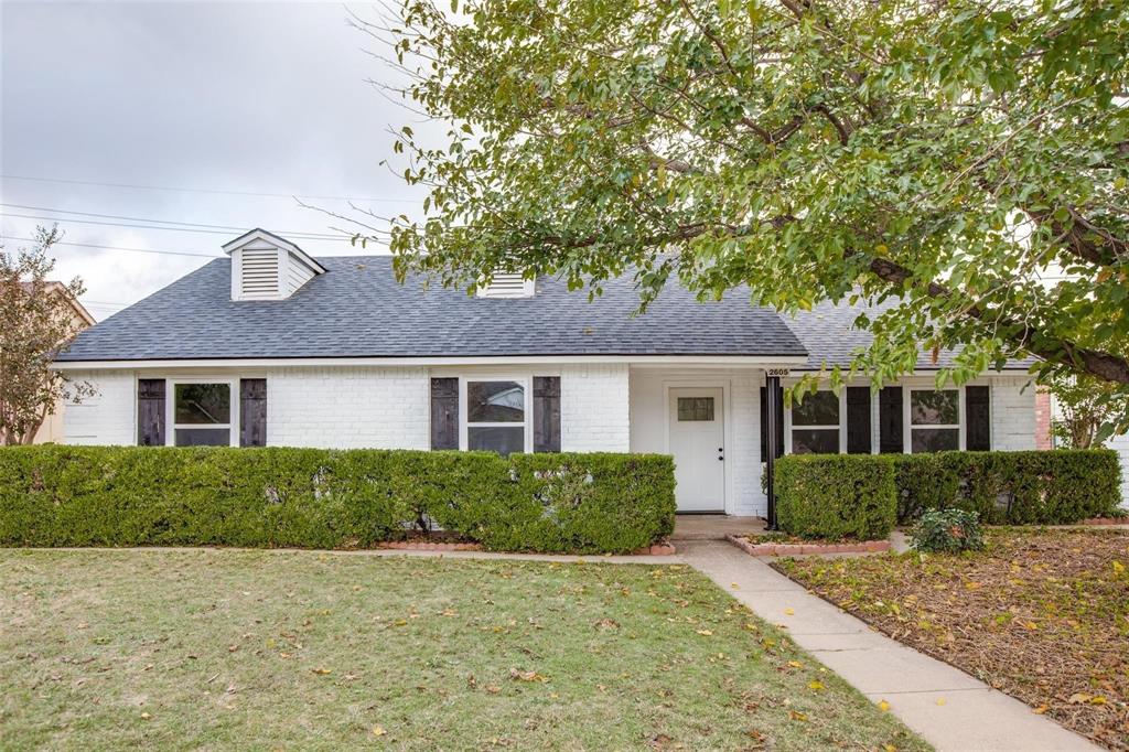 front view of a house with a yard