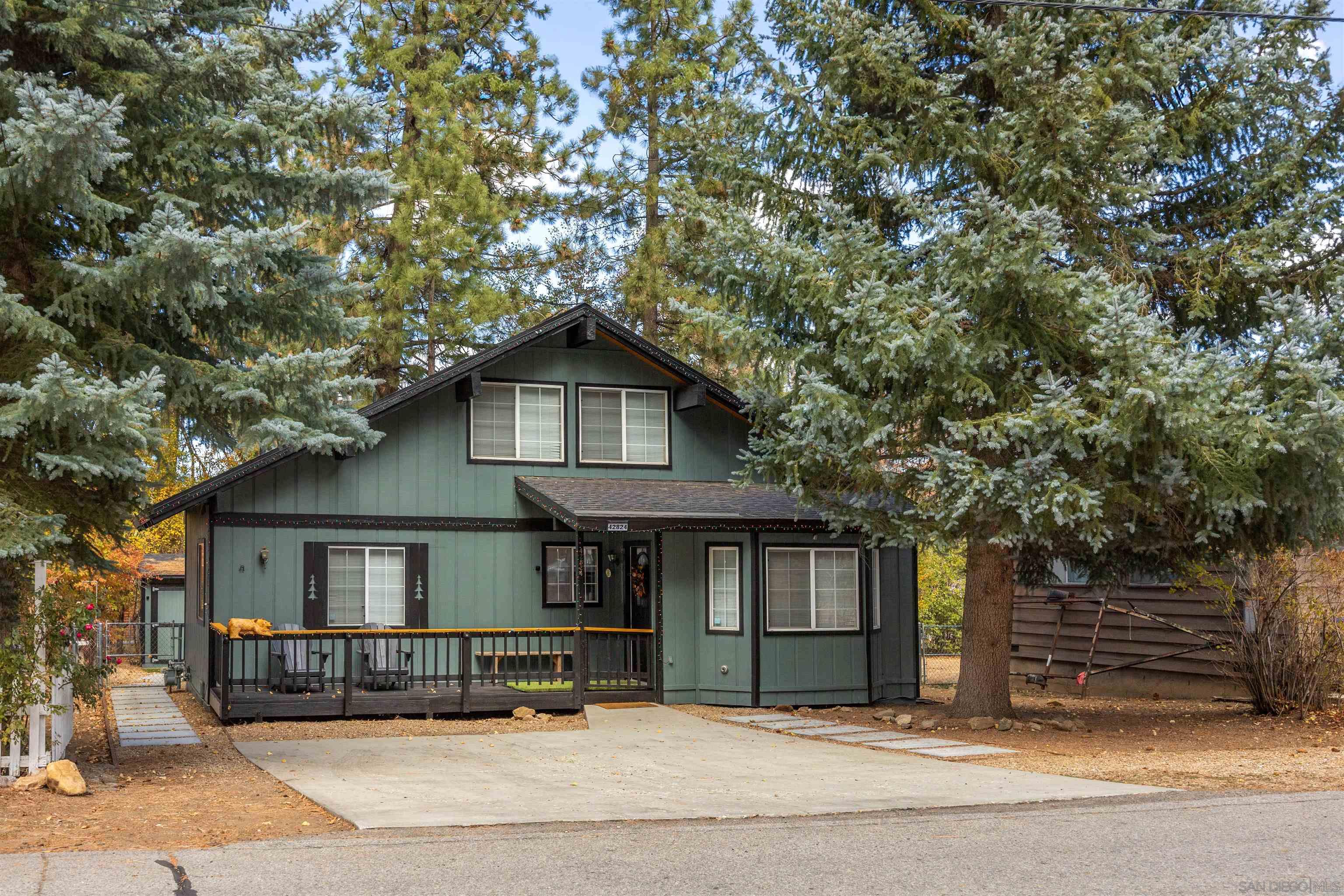 a front view of a house with garage