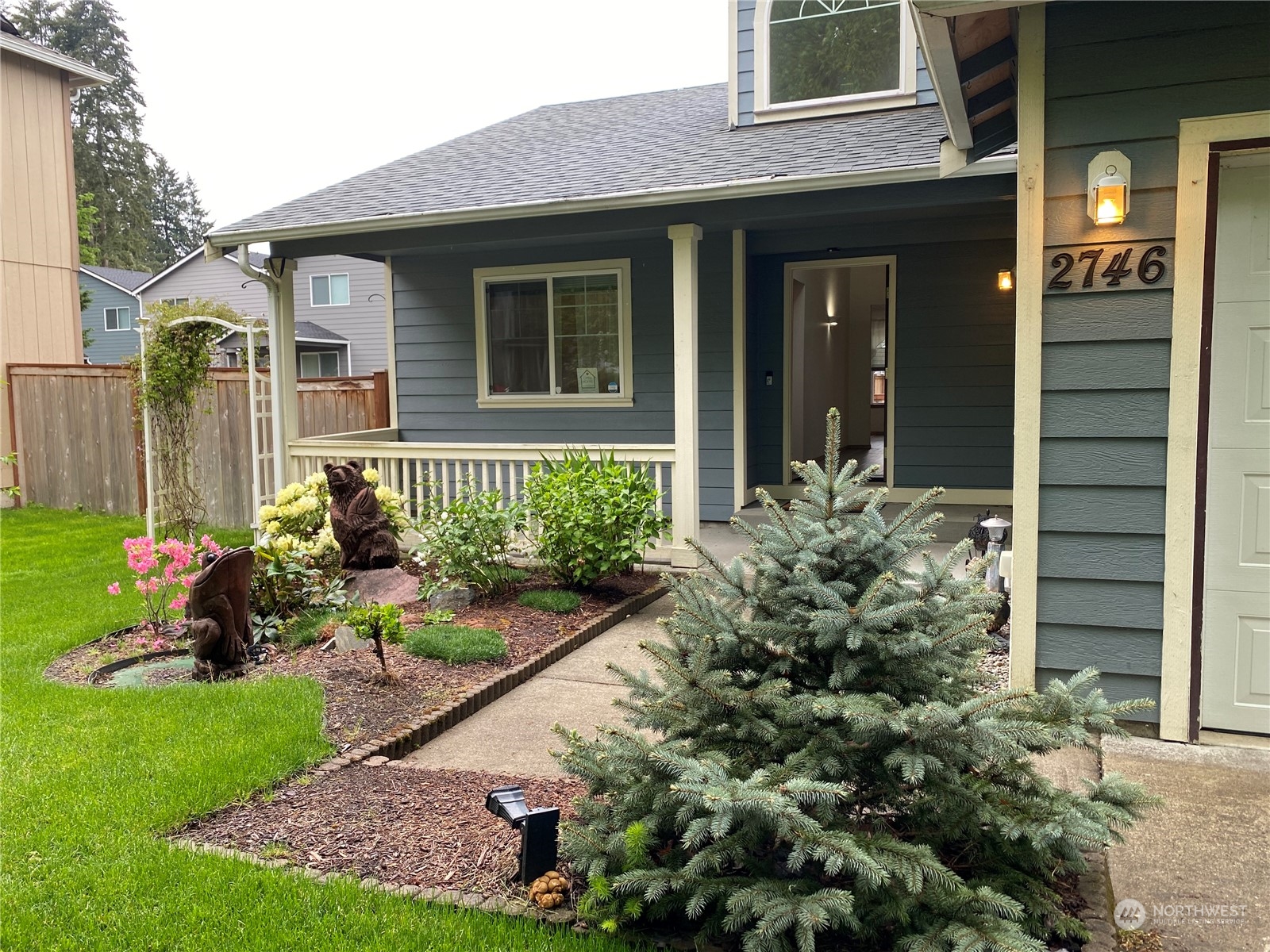 a front view of a house with garden