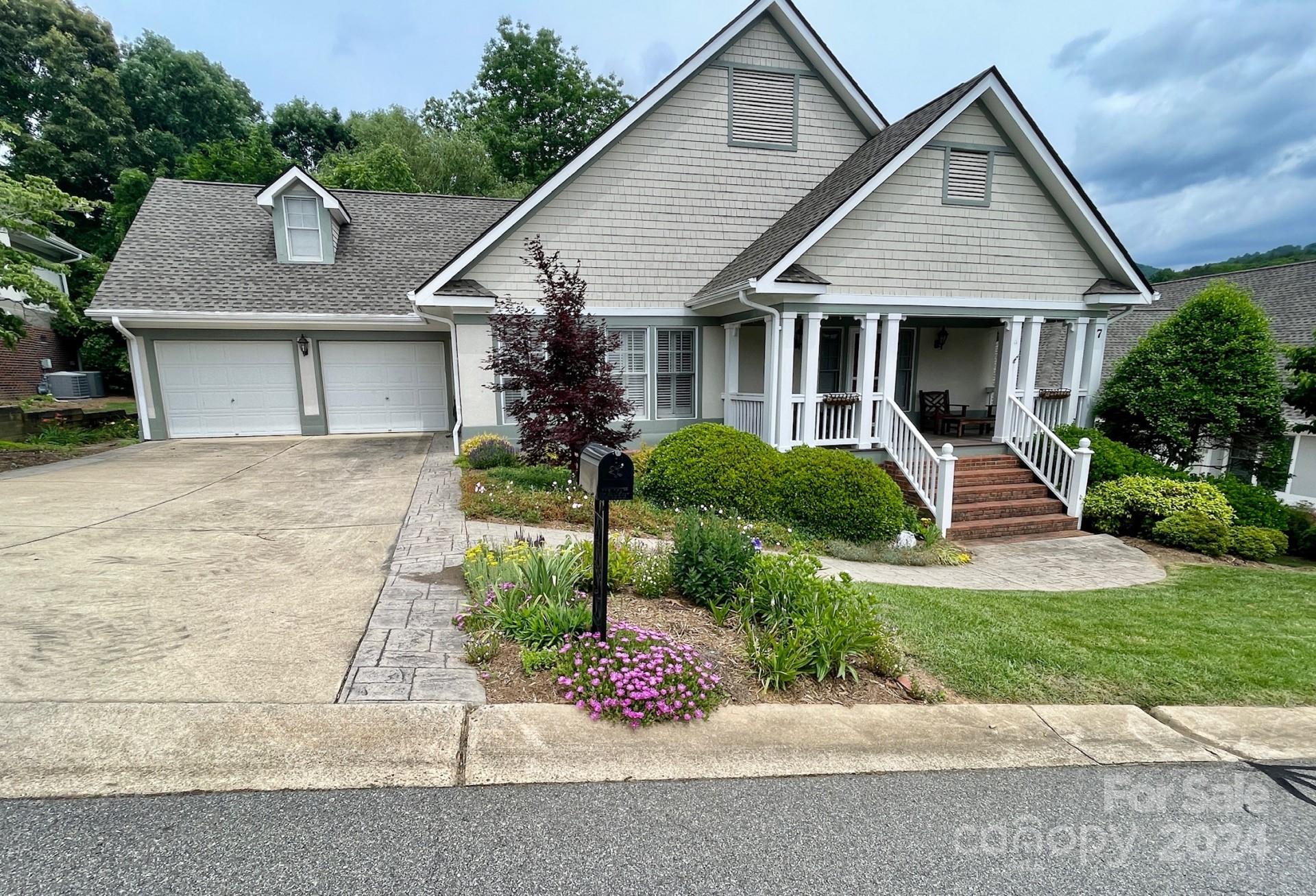 a front view of a house with garden