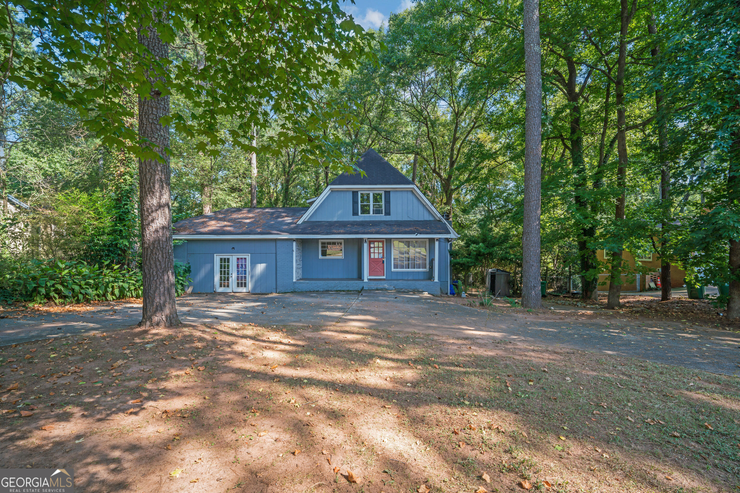 a front view of a house with yard