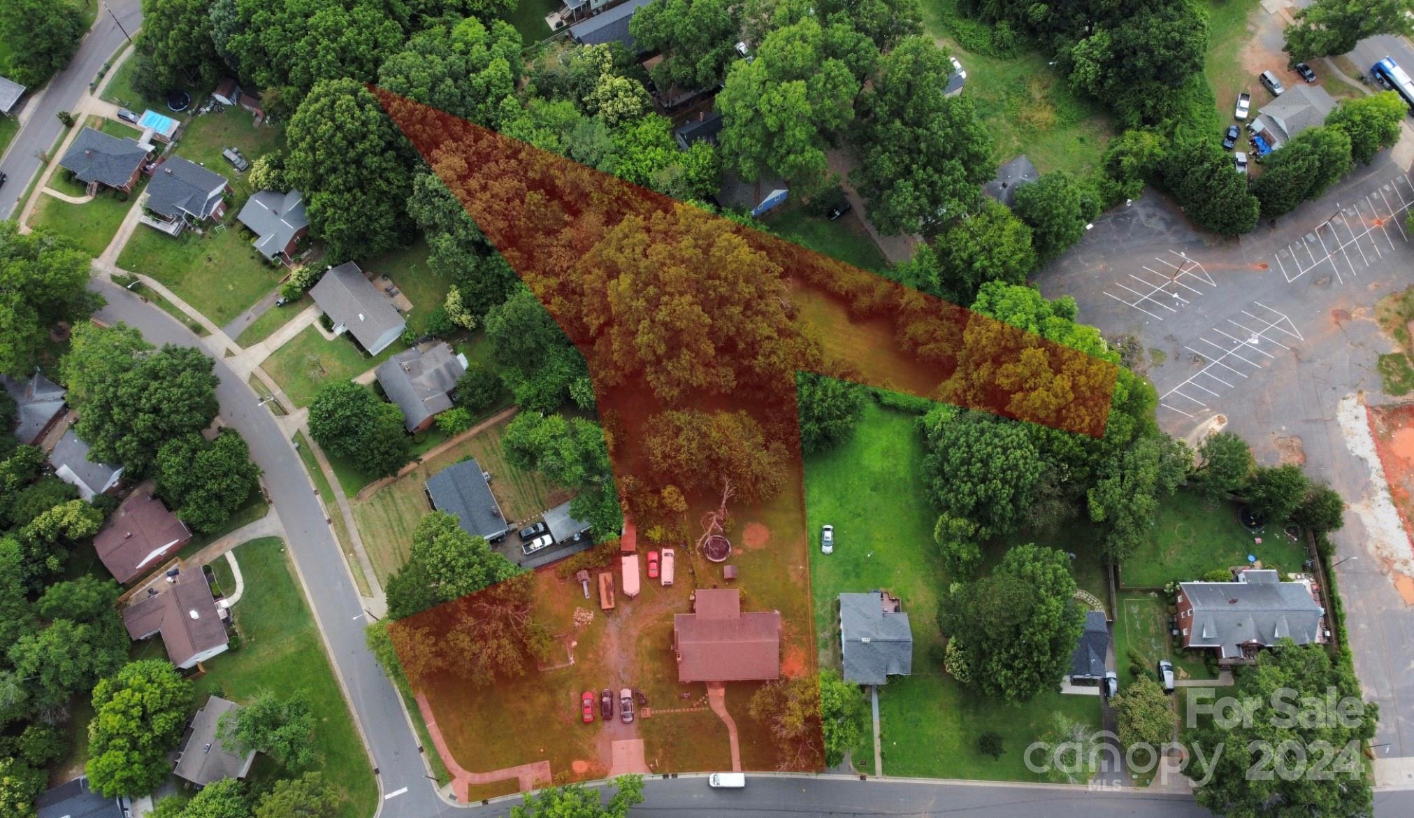 an aerial view of a house with outdoor space