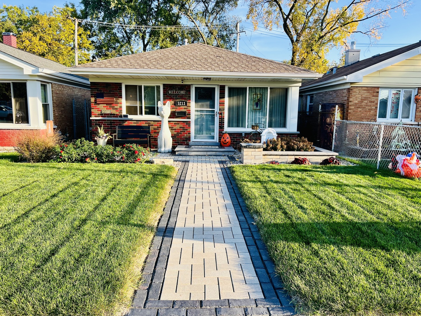 a view of a house with backyard sitting area and garden