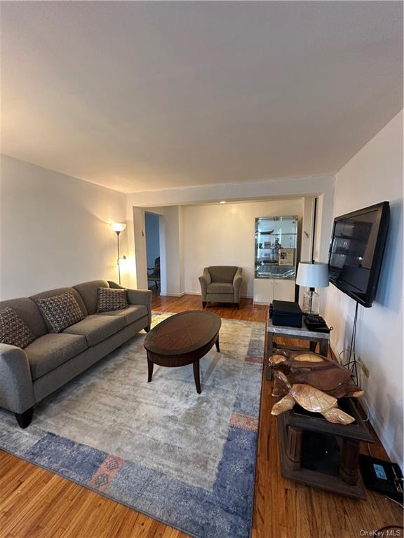 Living room with hardwood / wood-style floors