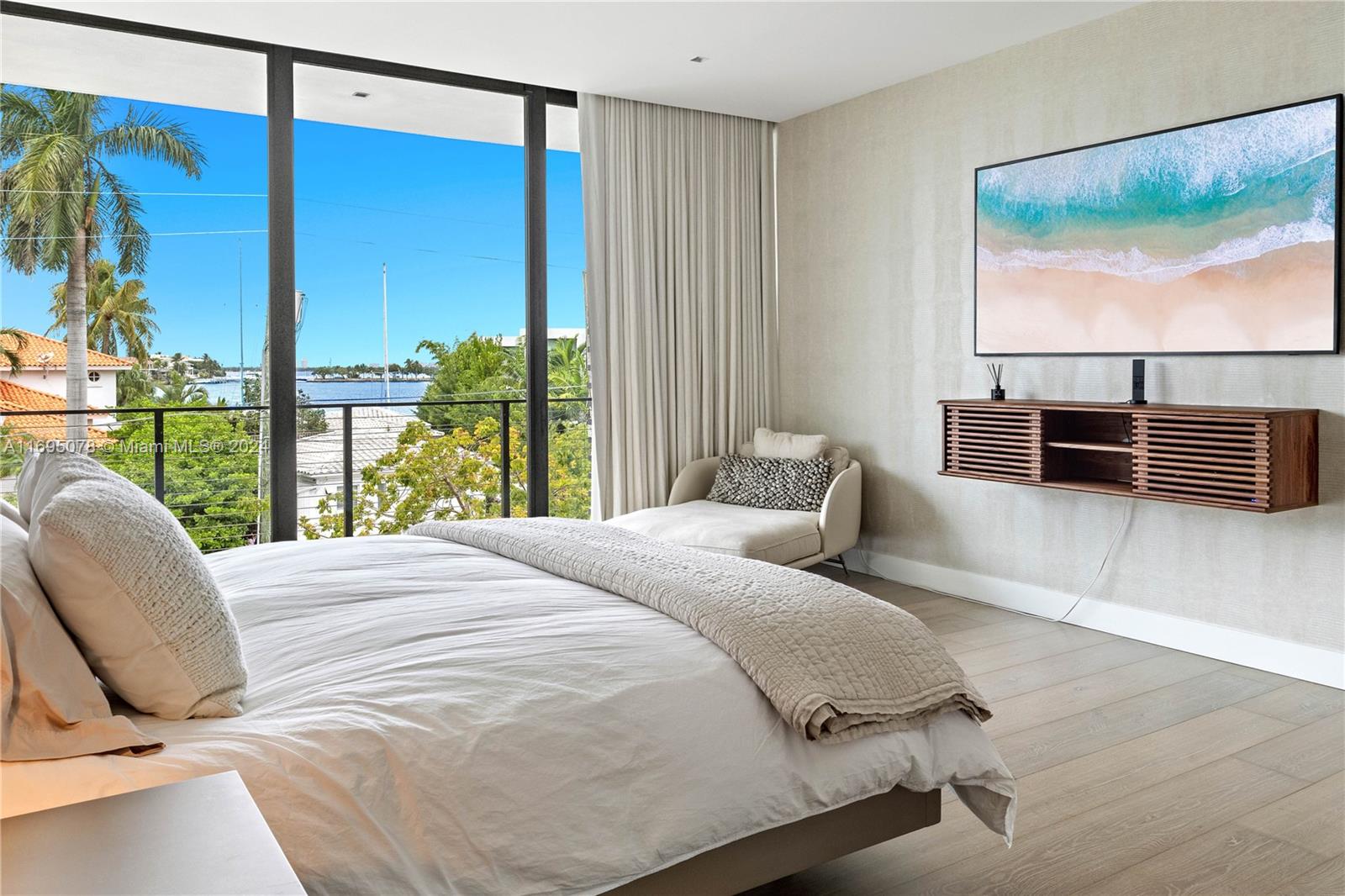 a bedroom with a bed and glass window