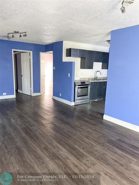 a view of living room filled with furniture and window