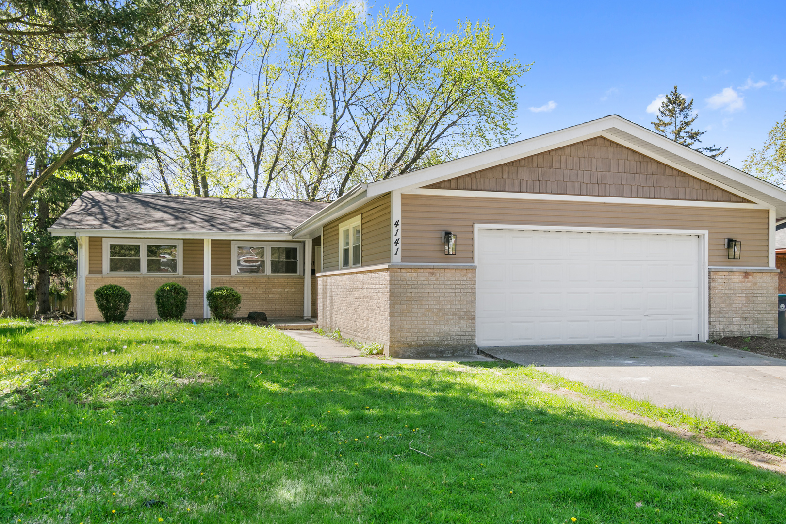 front view of a house with a yard