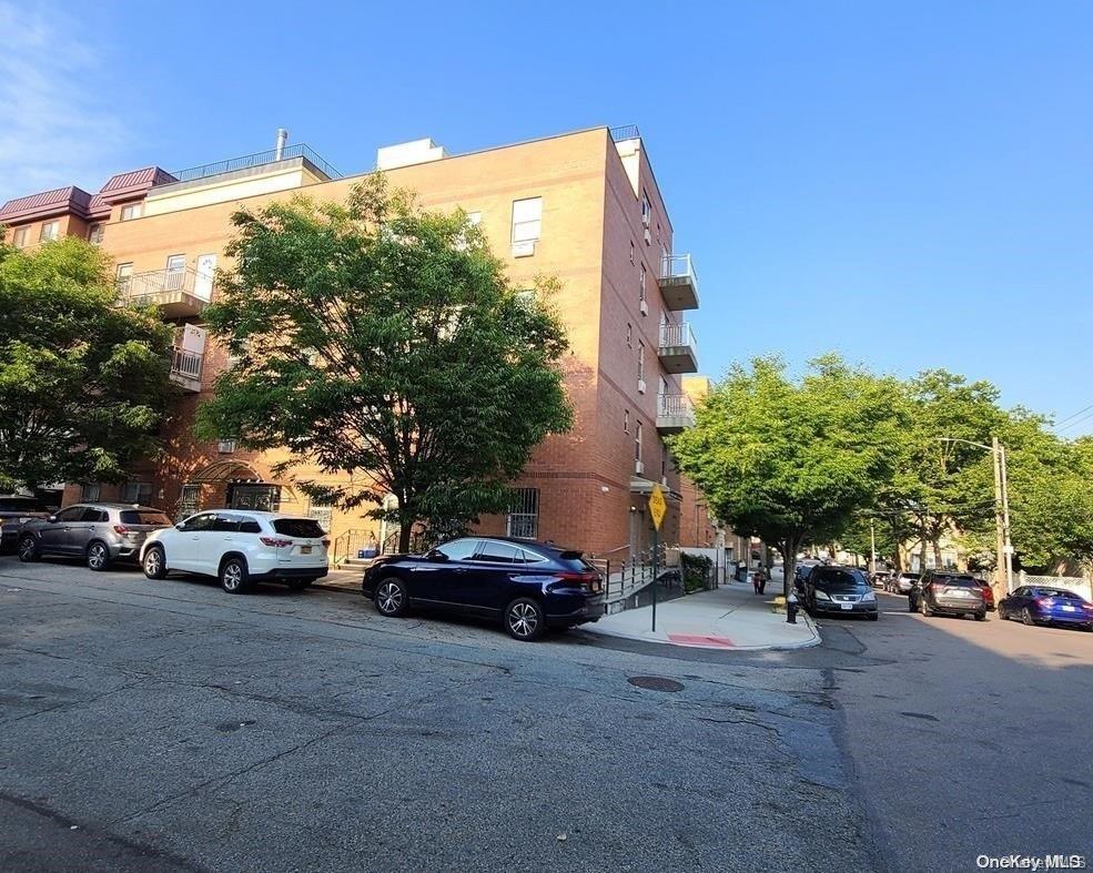 a view of street with parked cars