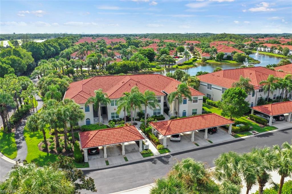 an aerial view of a house with a garden and swimming pool