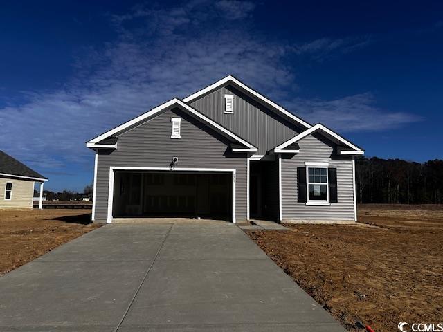 Craftsman-style house featuring a garage