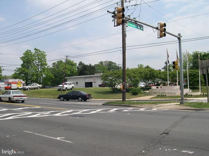 a view of street with parked cars