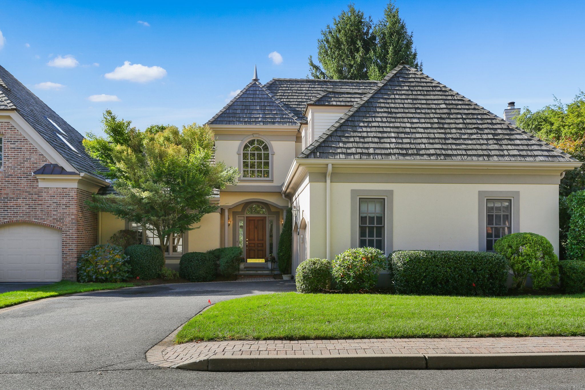 a front view of a house with a yard