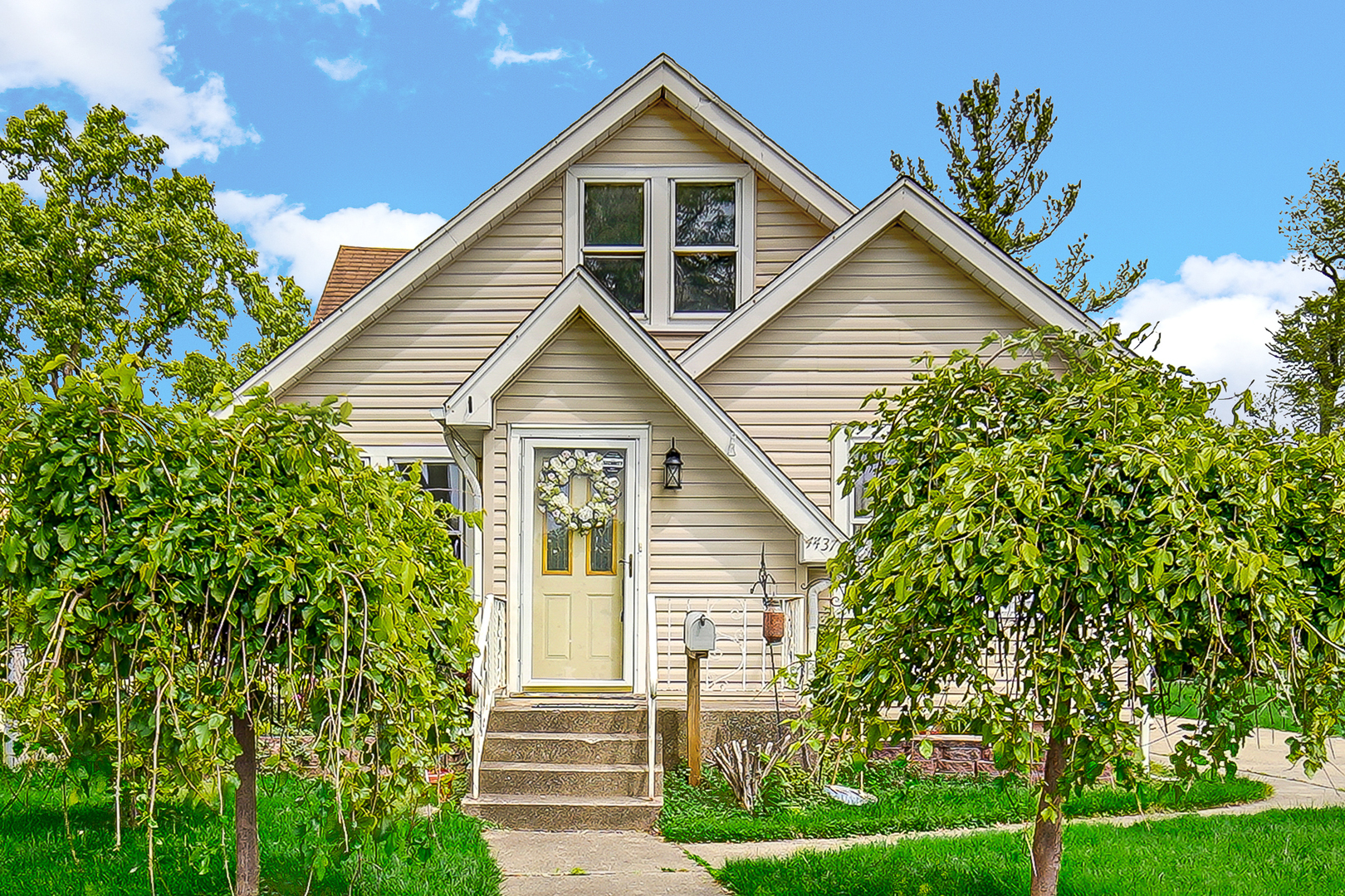 a view of front of house with a yard