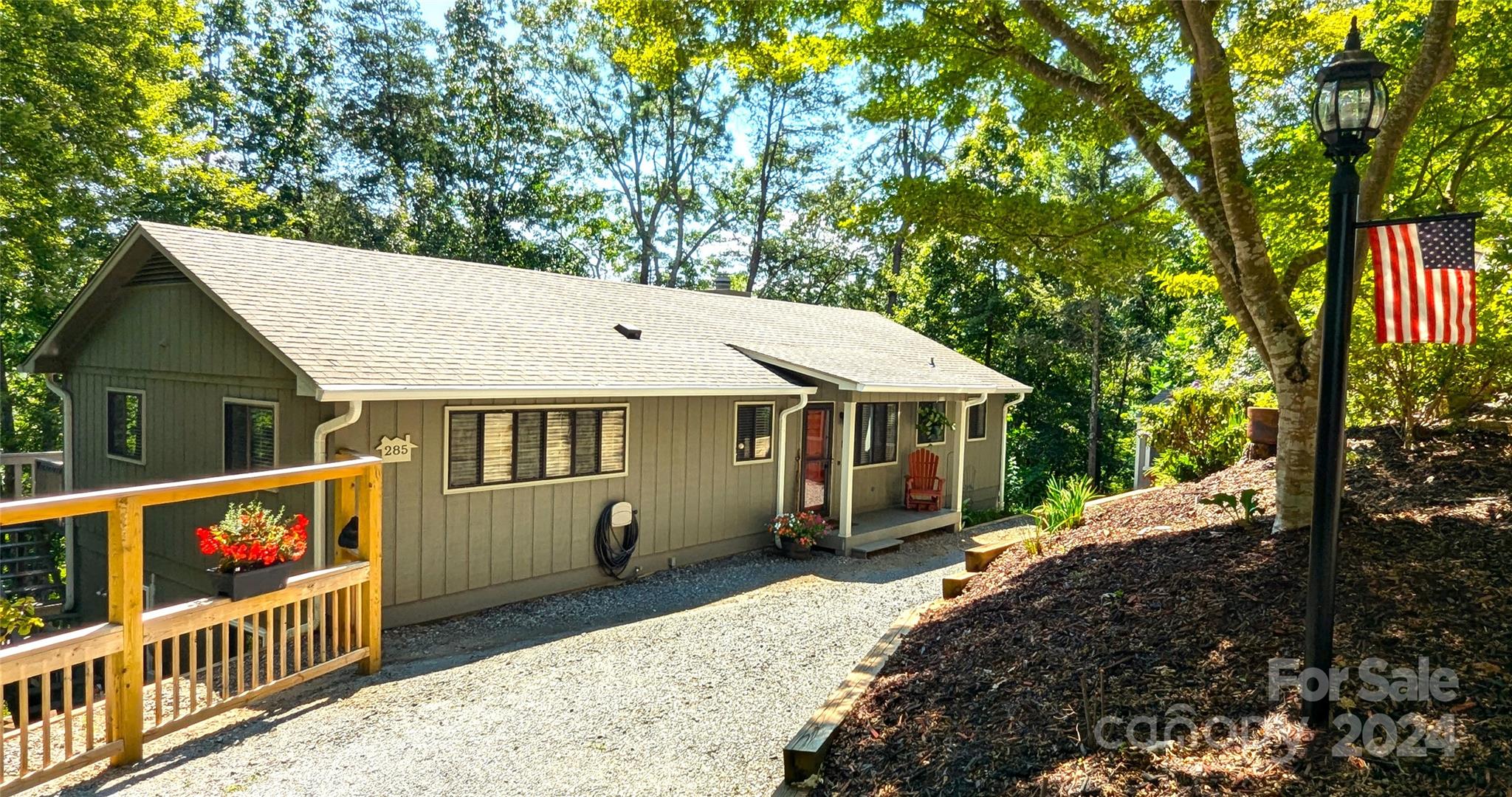 a view of a house with backyard and porch