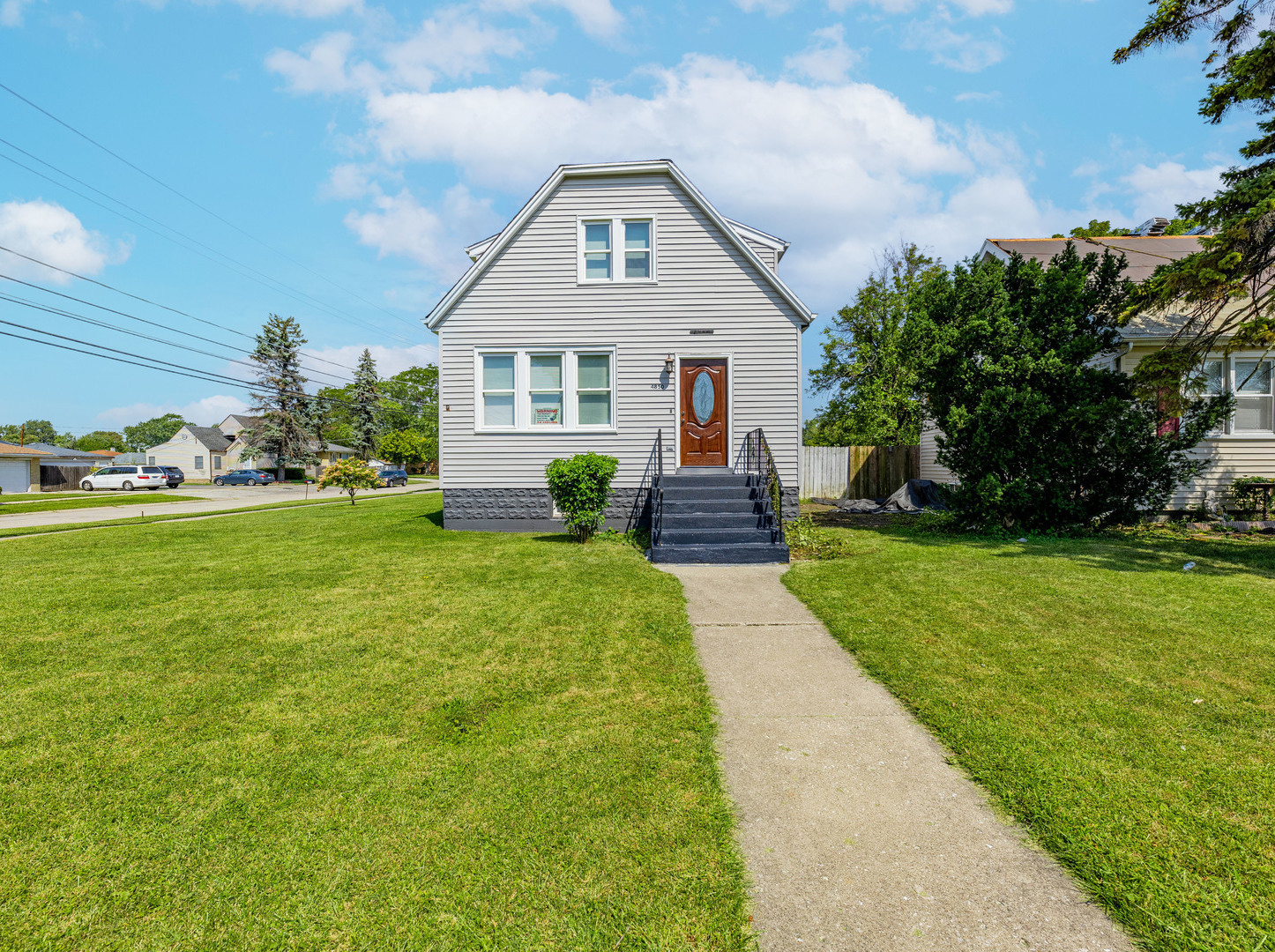 a front view of house with garden