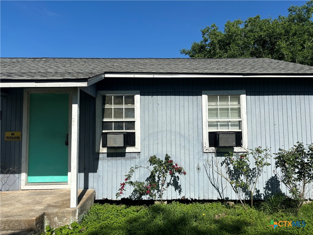 a view of house with yard and entertaining space