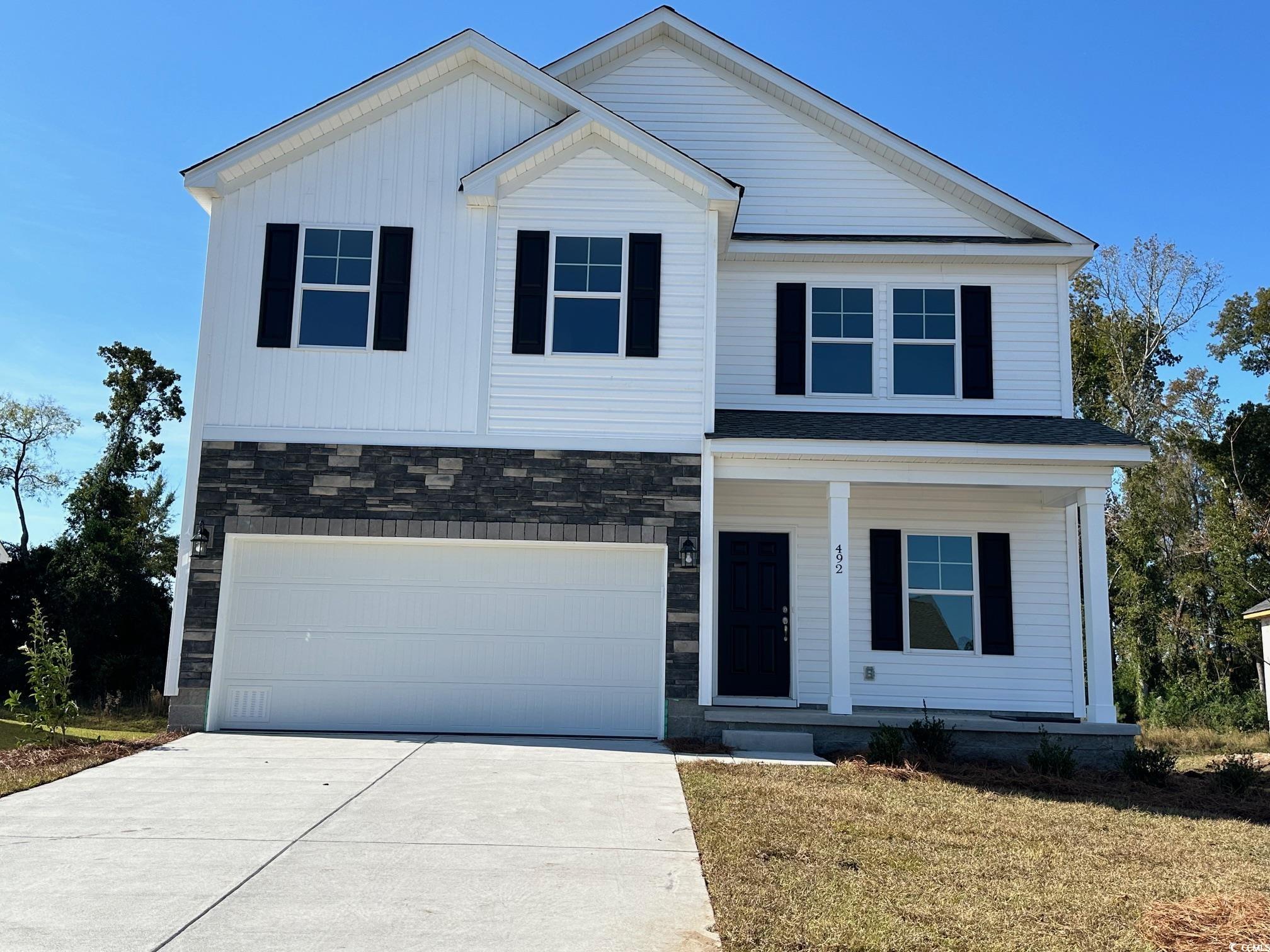 View of front of home featuring a garage and a fro