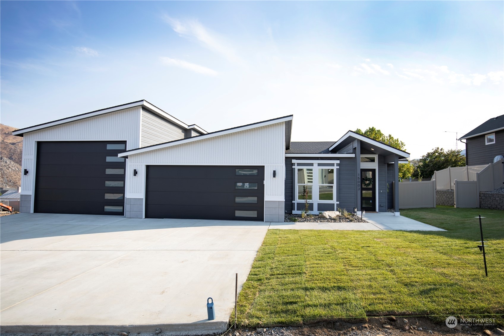 a front view of house with outdoor seating