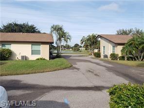 a front view of a house with a yard and a garage