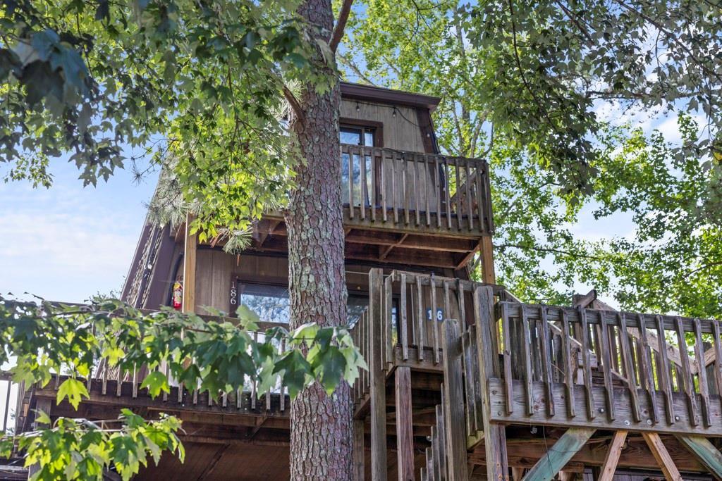 a view of a house with wooden fence