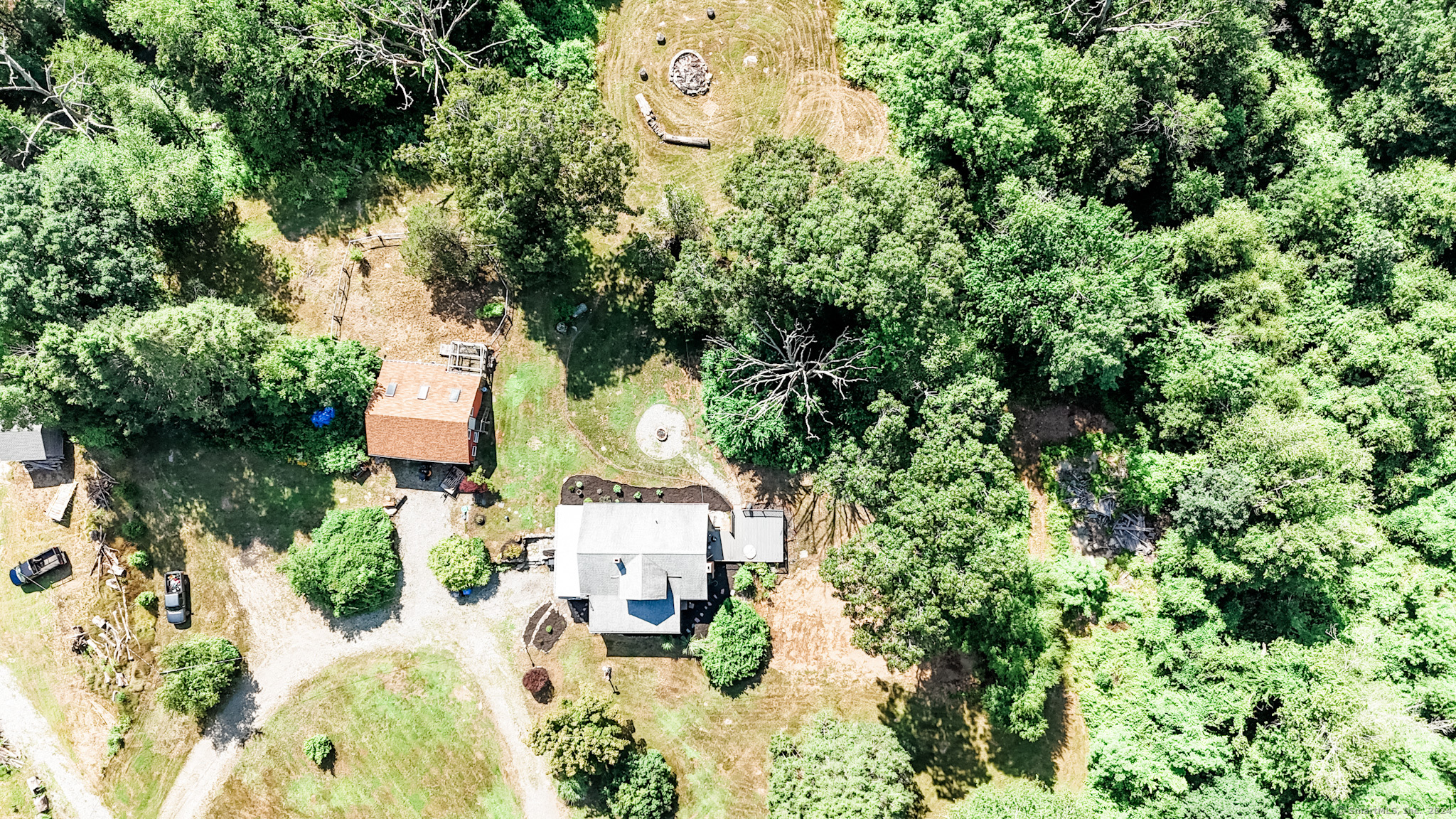 an aerial view of a house with swimming pool and garden view