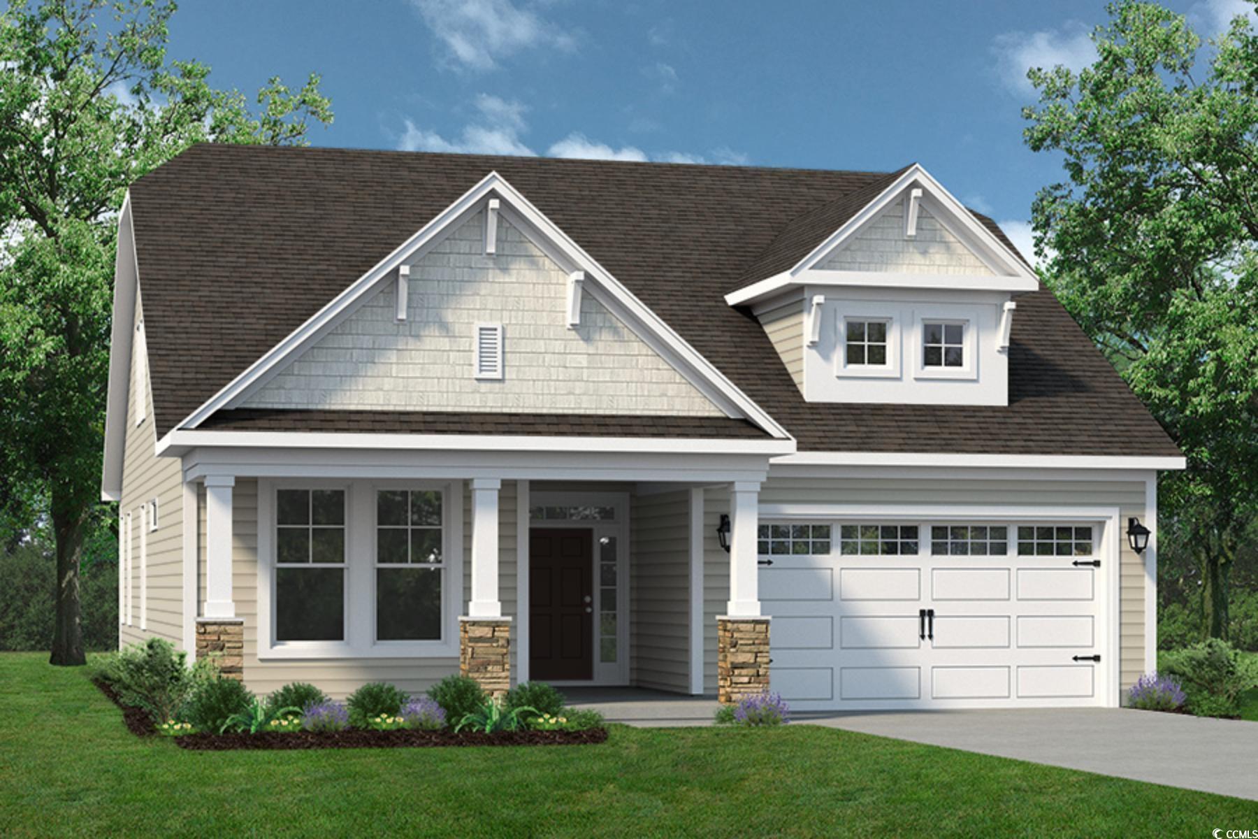 Craftsman-style house featuring a garage, a front