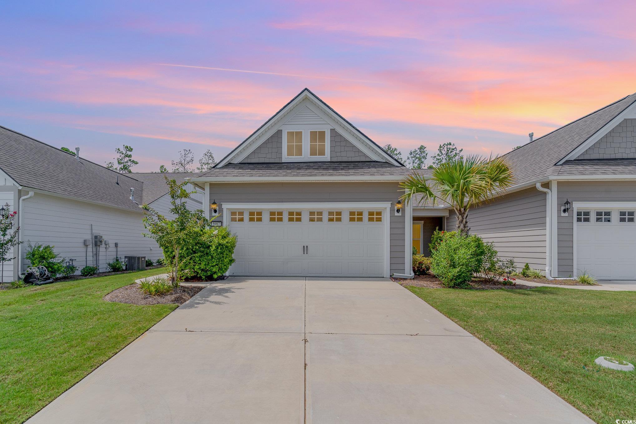 View of front of home featuring a lawn