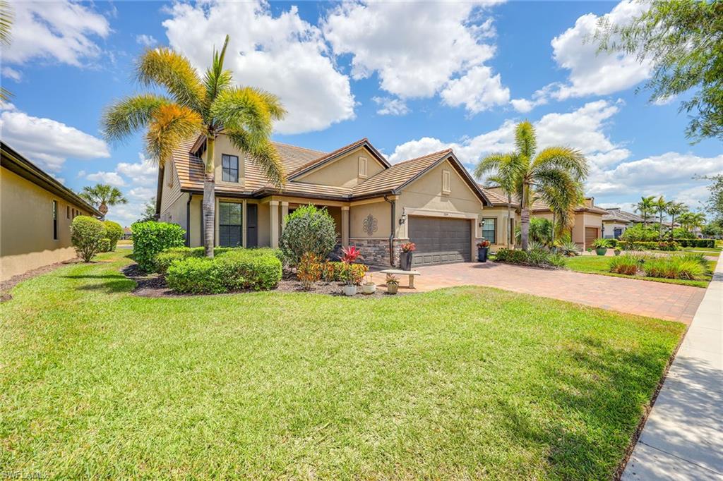 a view of a house with a swimming pool and a yard