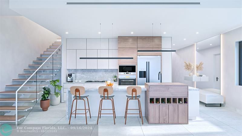 a large kitchen with lots of counter space and windows