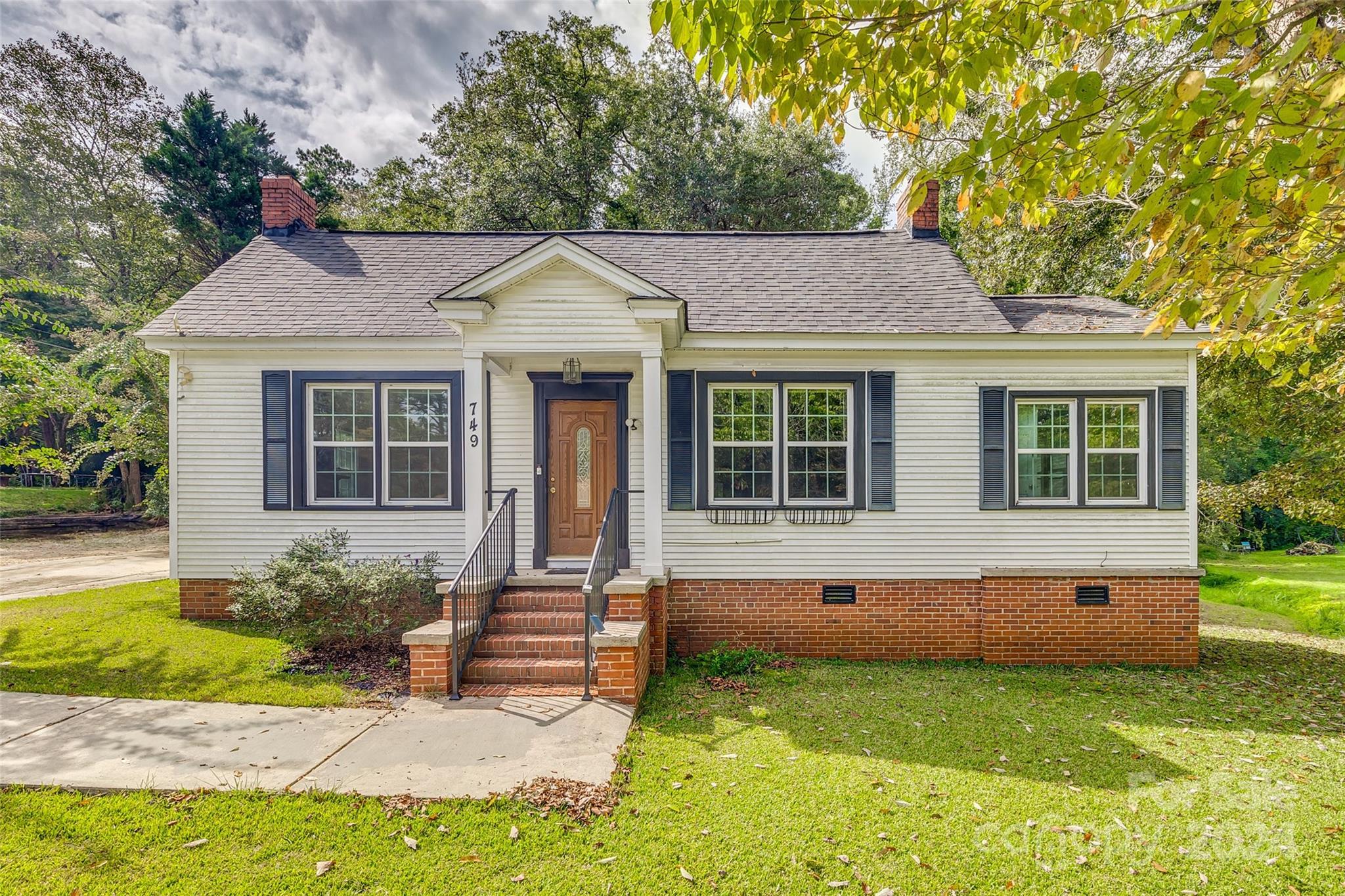 a front view of a house with a yard