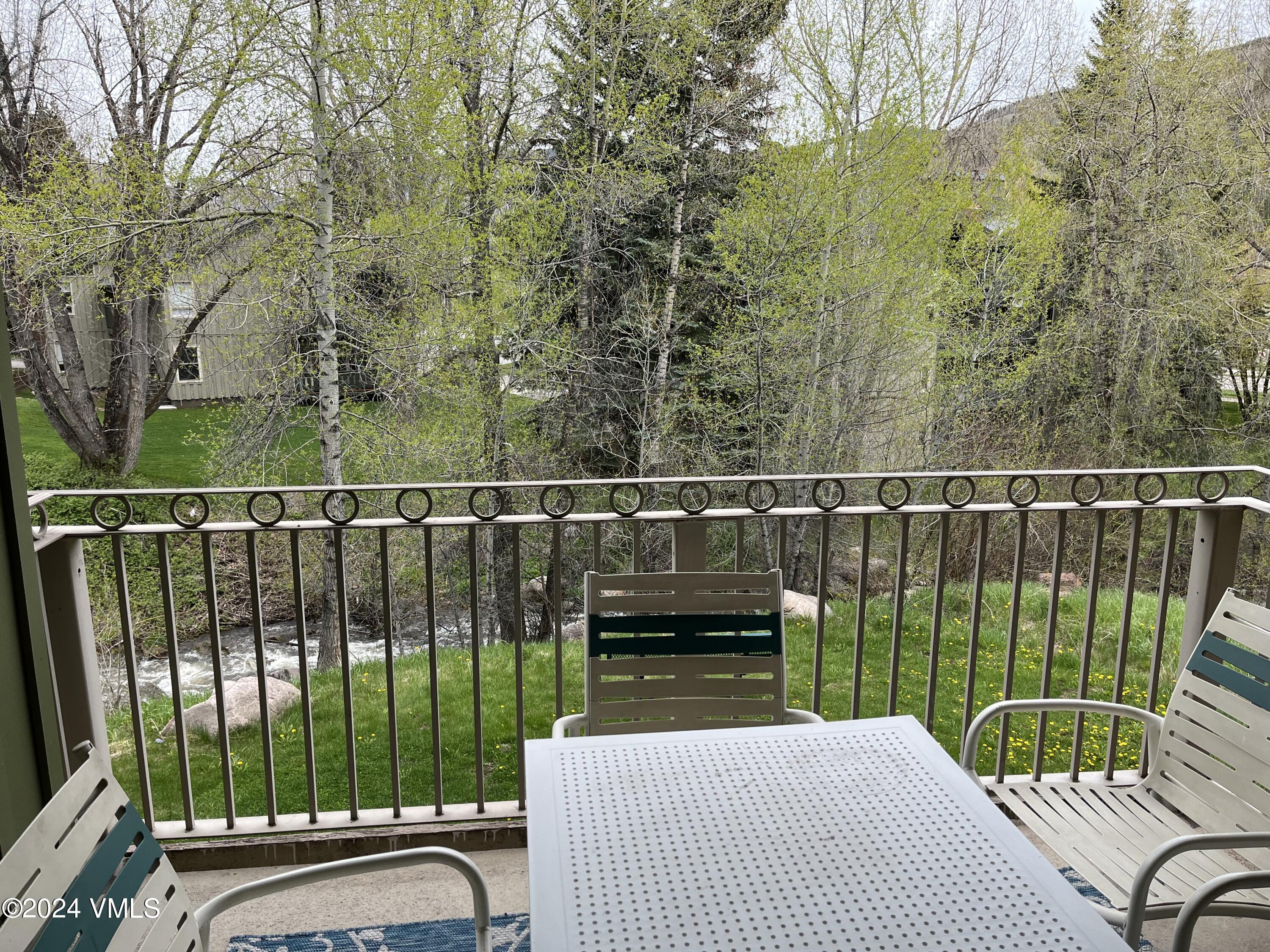 a view of balcony with furniture