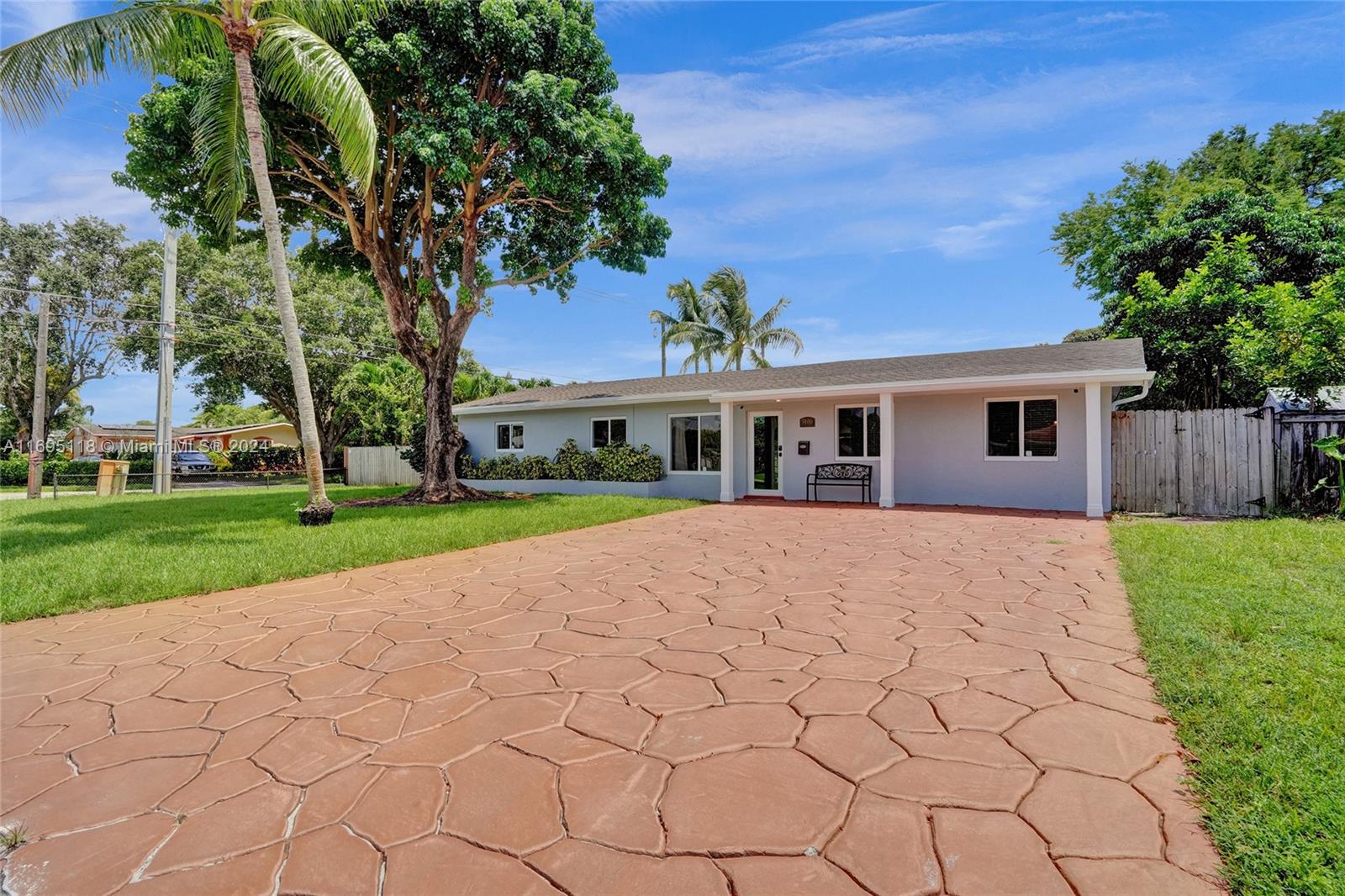 a view of house with yard and entertaining space