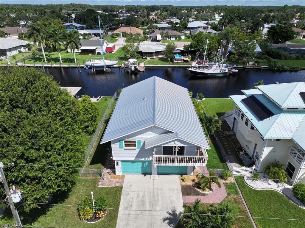 a aerial view of a house with a lake view