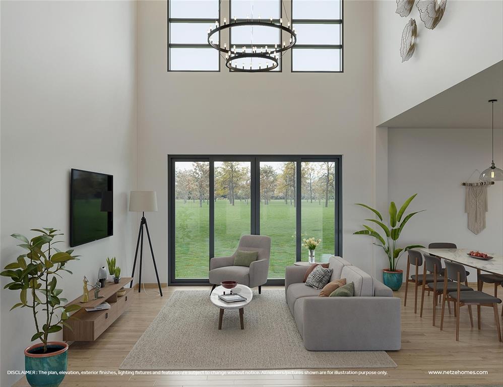 a living room with furniture potted plant and a flat screen tv