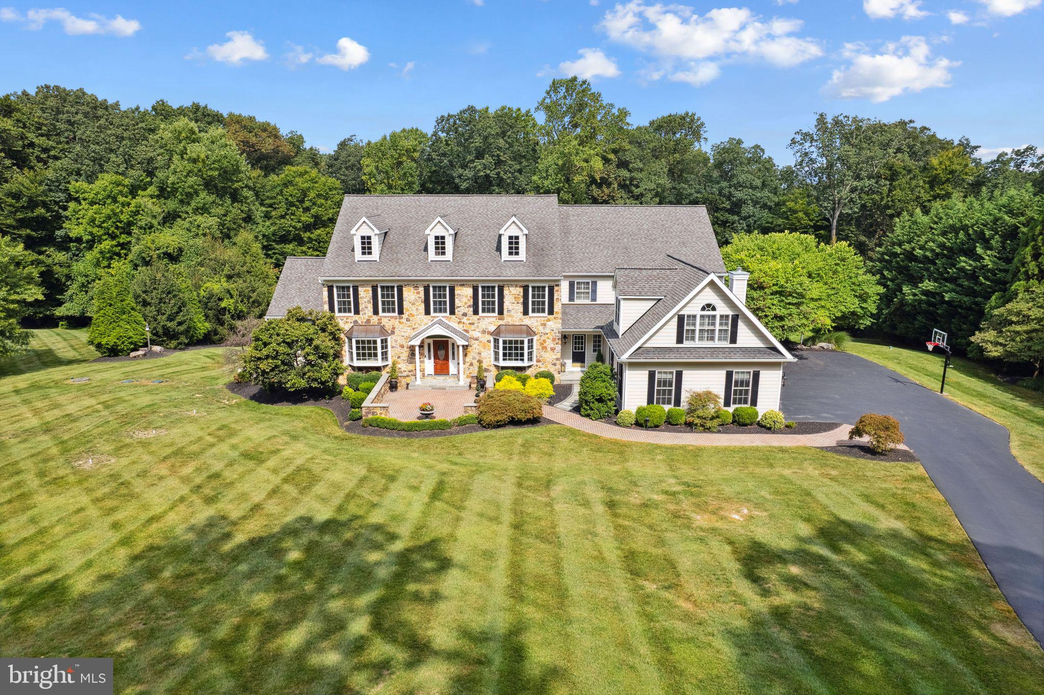 Gorgeous stone colonial with HardiePlank