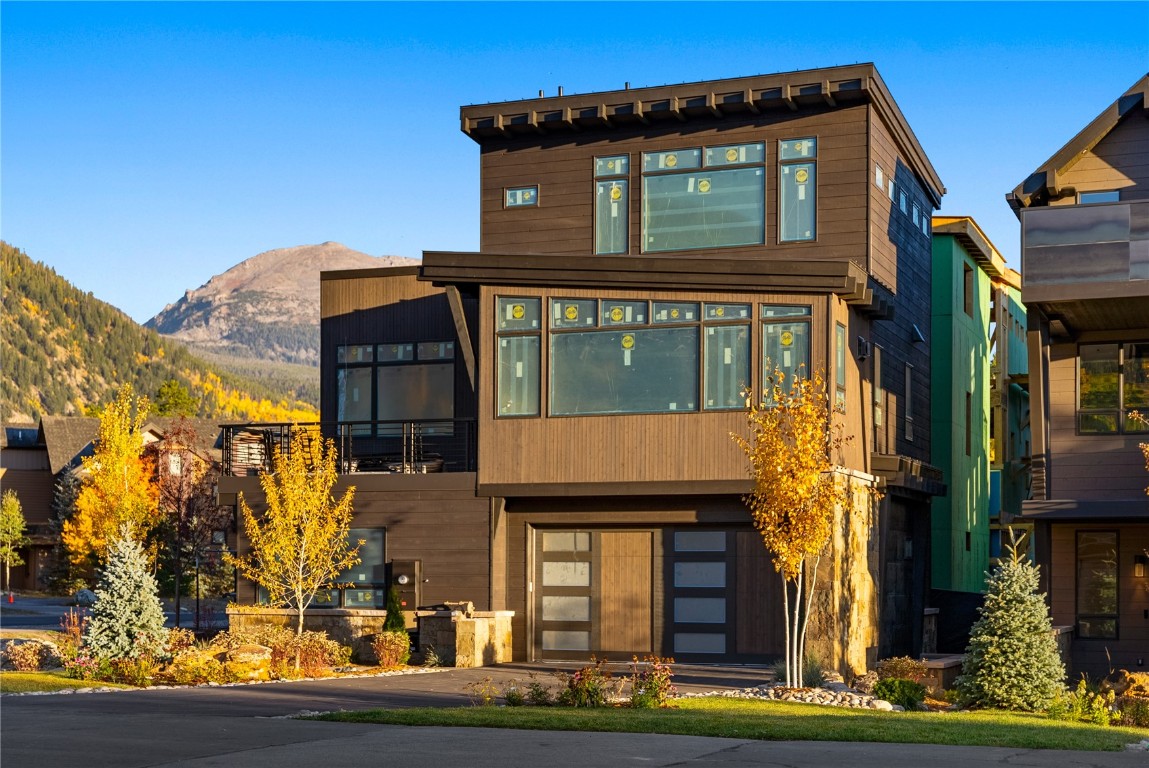 a front view of a house with glass windows