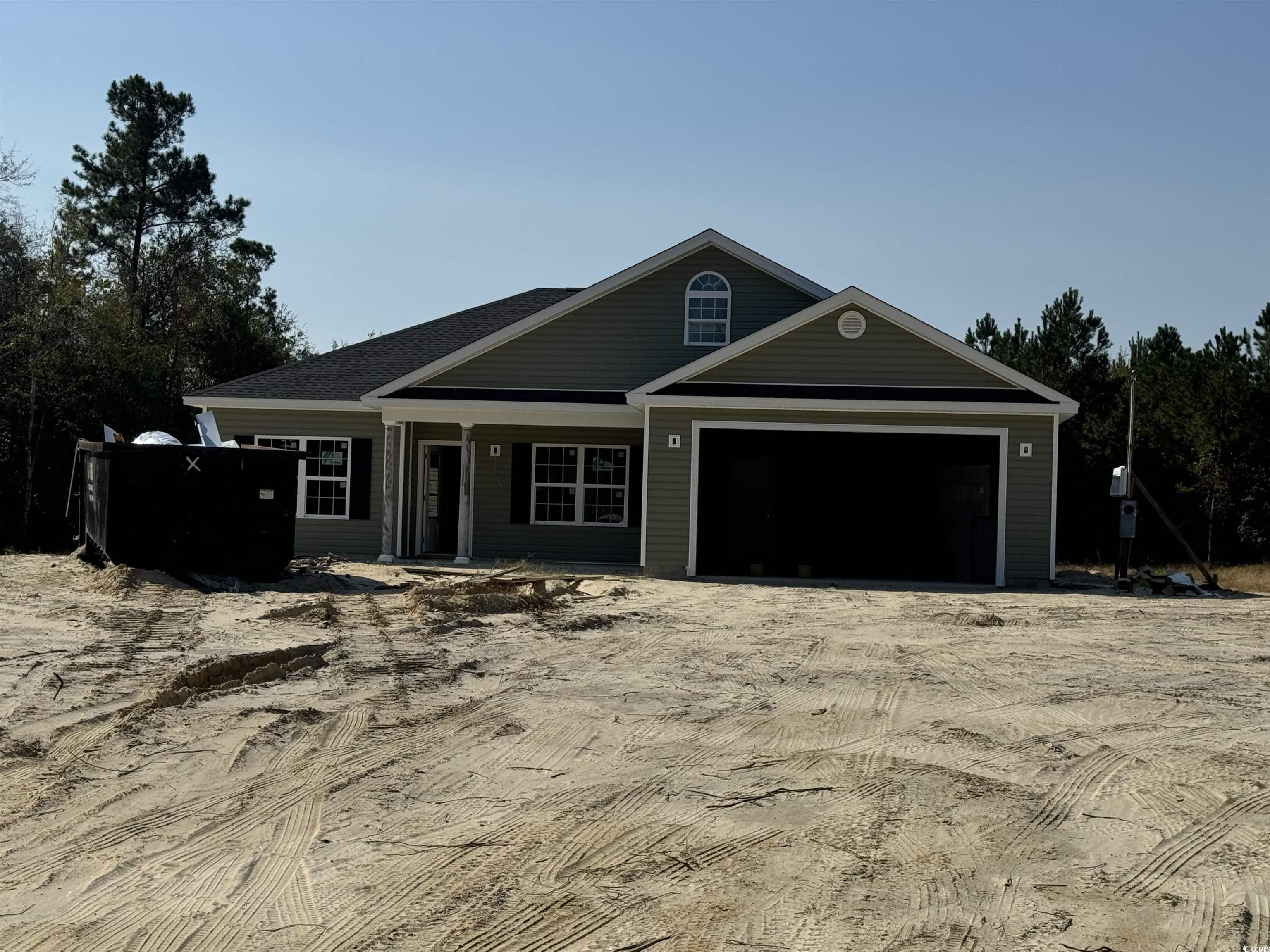 View of front of home featuring a garage