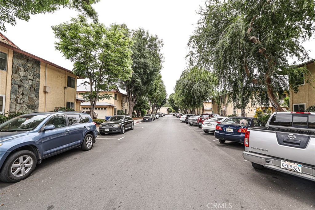 a view of a cars park in front of a house